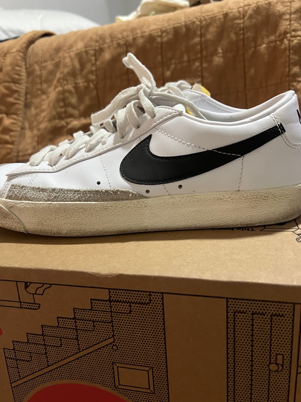 Nike White Low-Top Sneakers with Black Swoosh and Cream Sole